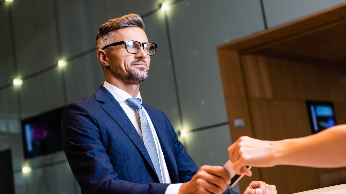 handsome-businessman-in-suit-banner-min